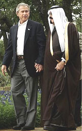 Bush and Saudi walking hand in hand 