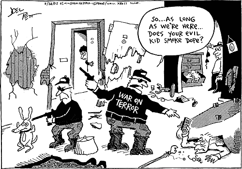 WAR ON TERROR thugs destroy a home, hold a gun on a dog, and look at women's underwear during a raid.
Not finding anything terror related, one thug says, So...As long as we're here... Does your evil kid smoke dope?