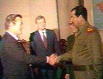 Rummy and Saddam shaking hands photo